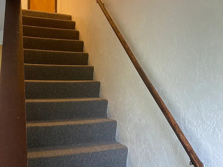 Stairs to bedrooms and full bathroom