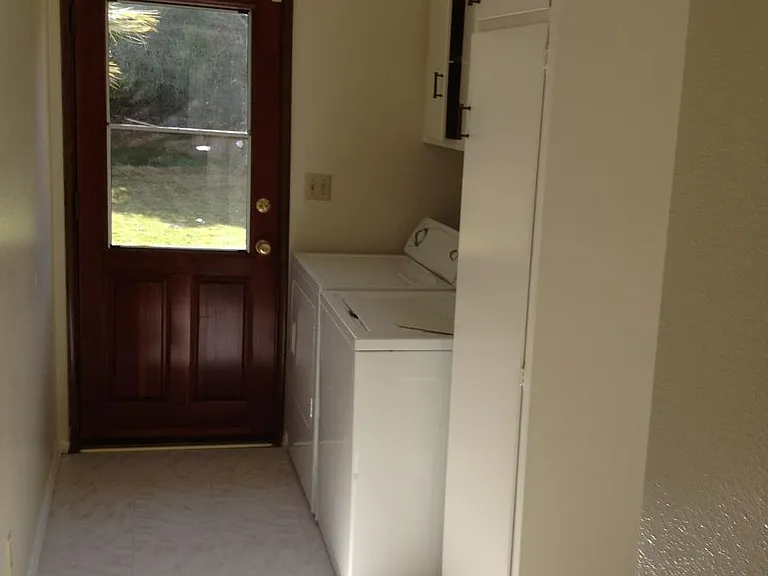 Laundry room with door to yard