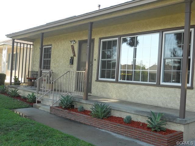 Long porch with new drought resistant plants.  Dual pane windows