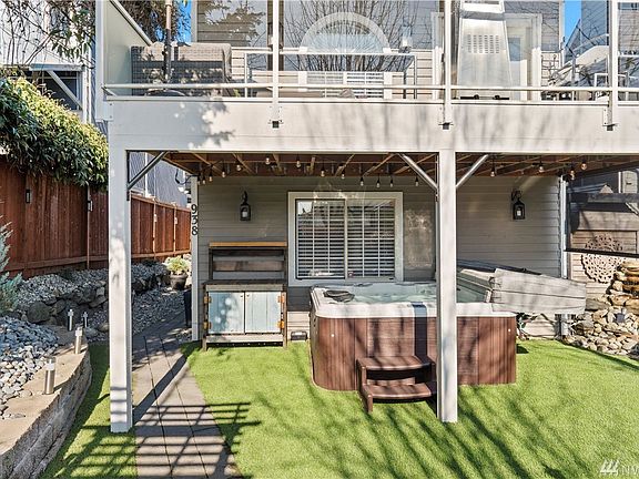 No lawn maintenance! ForeverLawn artificial turf has transferrable 10 year warranty. Remote controlled screen for extra privacy in the hot tub.