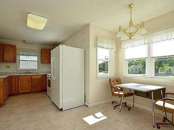 Kitchen. Main Level - All newer cabinets and hardware. Hook up for gas or electric stove and washer & dryer.