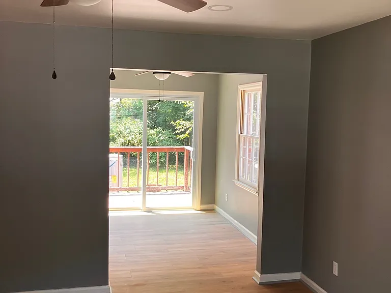 Living room that open to kitchen, dining and out side deck.