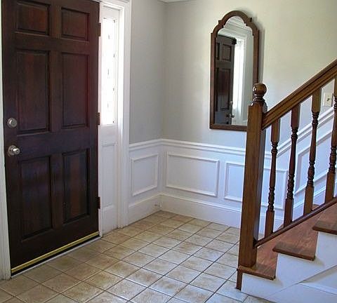 Upgraded wainscotting, crown molding and trim throughout
