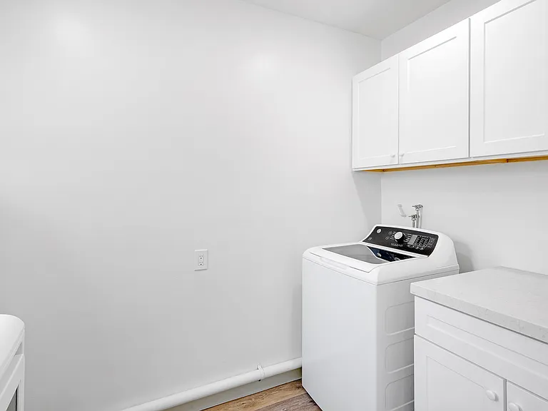 Also, laundry units in garage with storage room for unit A only.