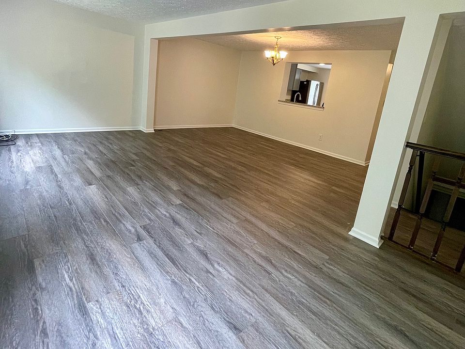 Living and dining room with new wooden flooring.