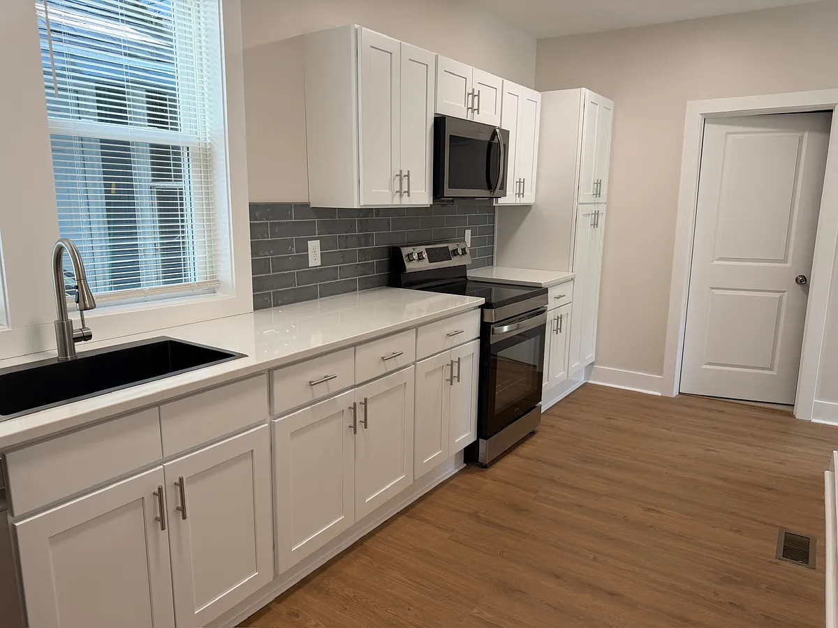 kitchen leading to bathroom/laundry - 202 Vermont St #1