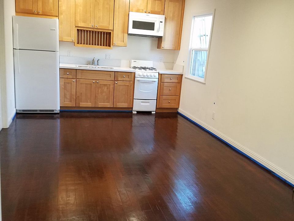 Main room new kitchen / appliances, wood floor