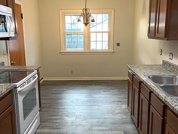 Newly remodeled kitchen with stove and fridge