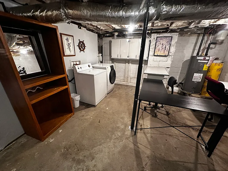 Laundry area in unfinished basement. There is a treadmill and exercise bike in the basement as well for winter exercise.