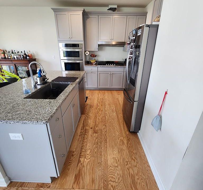 Modern upgraded kitchen with hardwood/stainless steel appliances