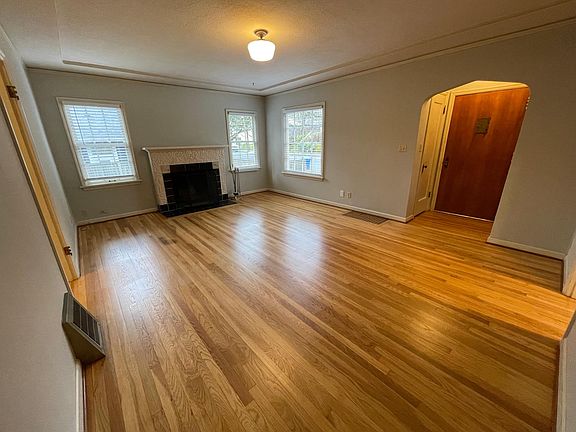 Spacious living room with a fireplace.