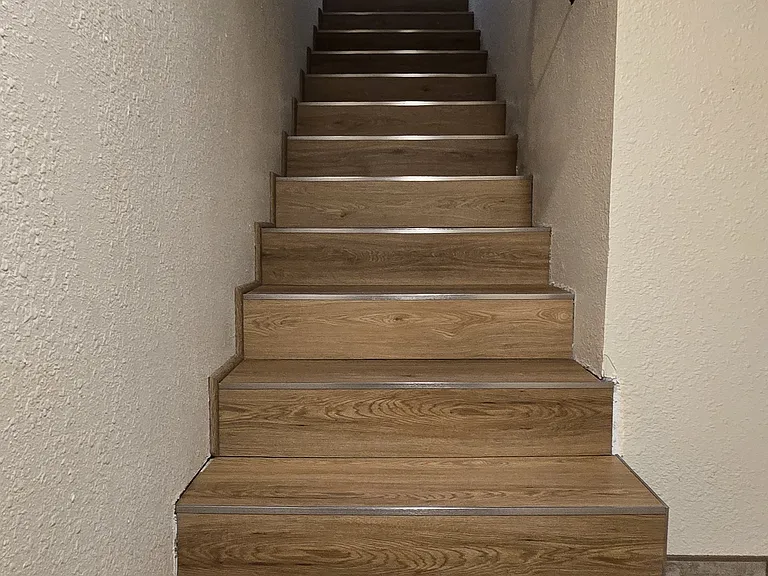 Stairway leading up from bedroom #3 and garage.