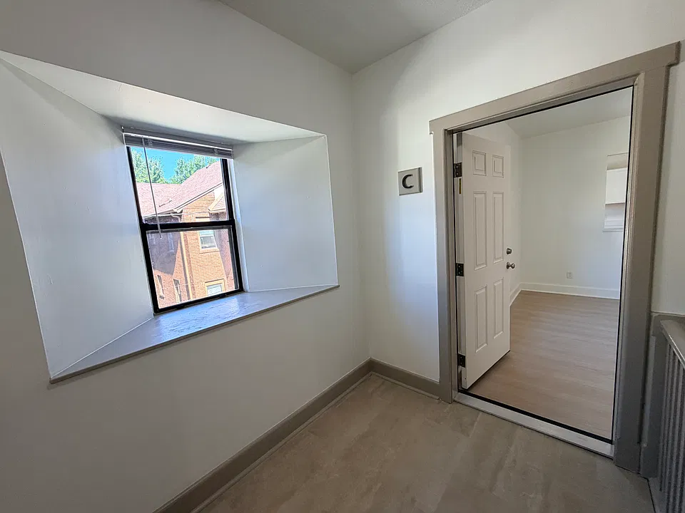 Common hall entrance. Also has private entrance to parking lot.