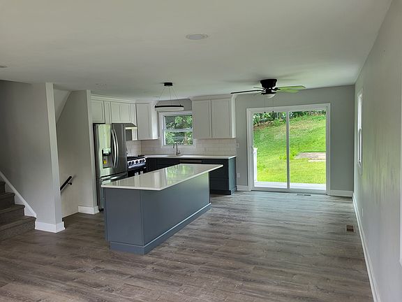 upper level living space with full kitchen appliances and easy access to rear yard