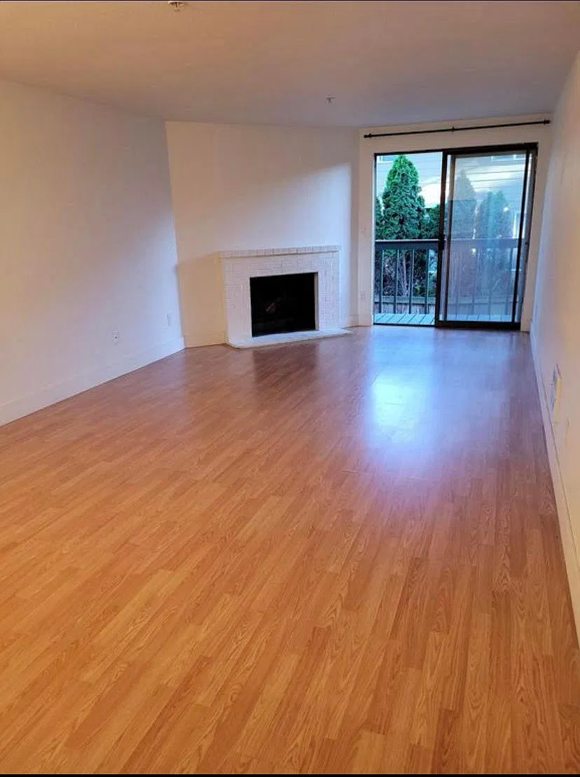 Living room with laminate flooring.
