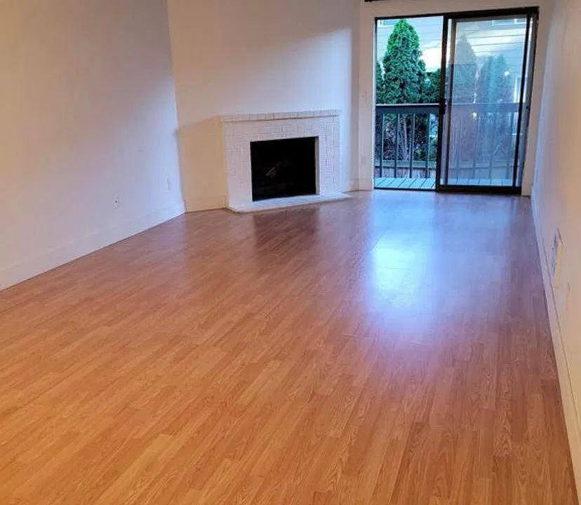 Living room with laminate flooring.