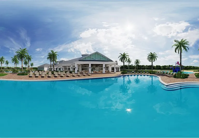 The expansive resort-style swimming pool features plenty of spaces for lounging and enjoying drinks from the bar.