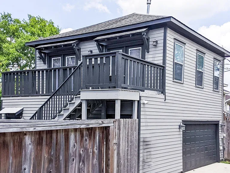View from Alley Driveway to Upstairs Deck/Apartment Entry