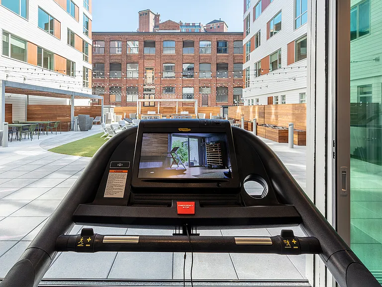 Your fully equipped fitness center opens up to the central courtyard.