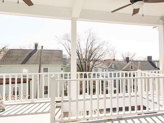 Outdoor deck with ceiling fans and electric