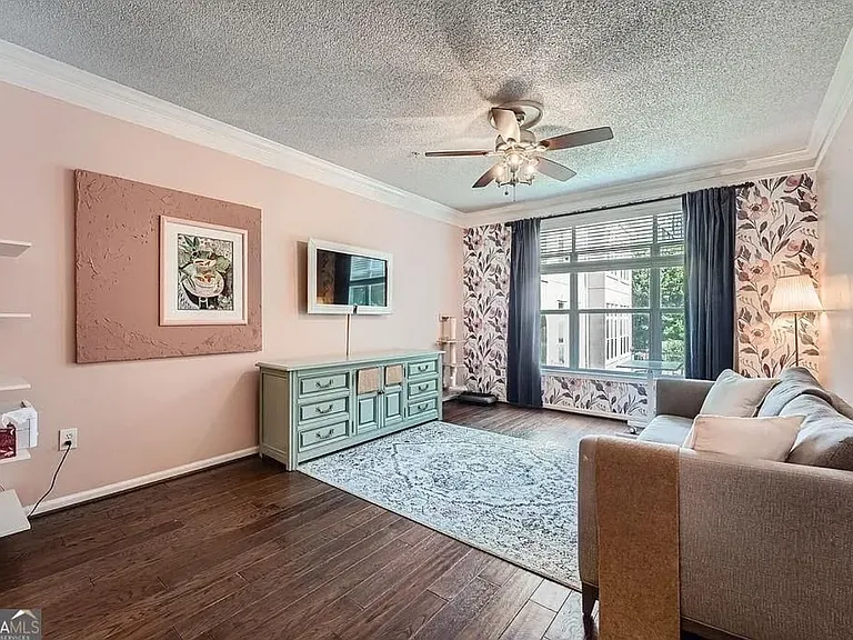 Main living area has room for dedicated dining area in addition to eating counter.