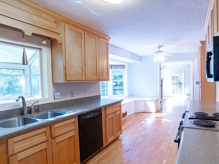 Solid surface counters, stainless steel sink with plant window
