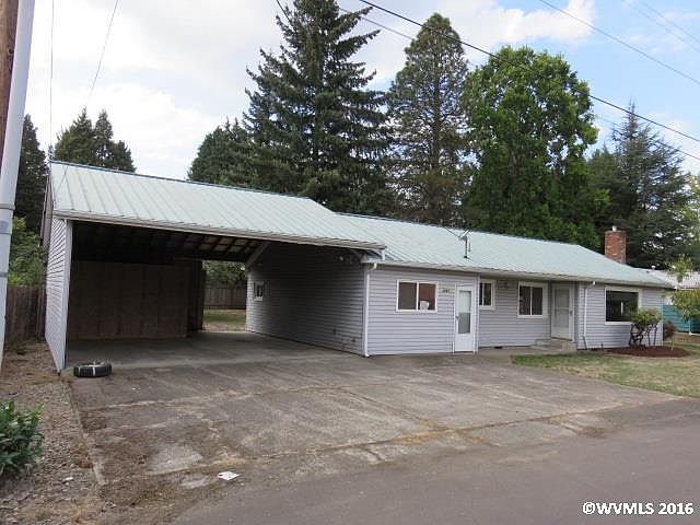 front of house w/ carport
