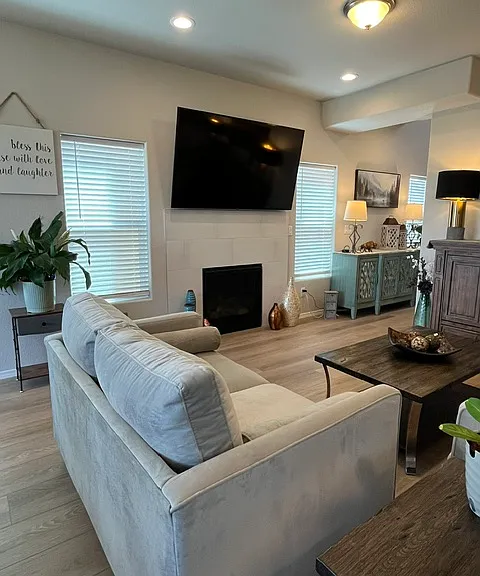 Beautiful tiles gas fireplace! 65 inch mounted TV included with rental.
