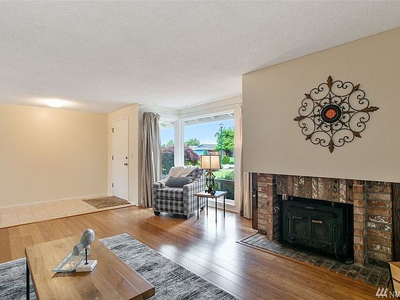 Looking back toward the spacious entry, you can admire the sunny corner windows.