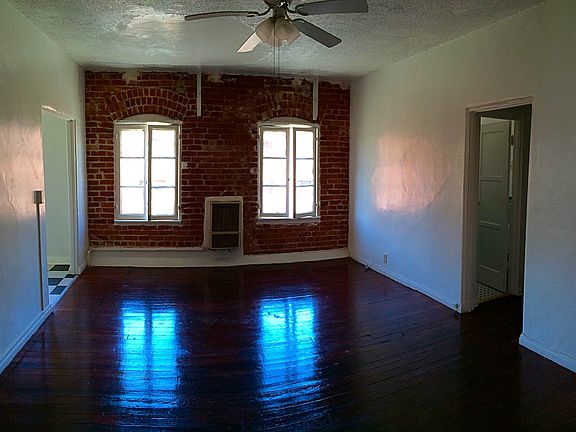wood floors and exposed brick