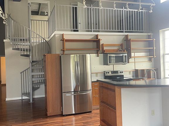 Brand new refrigerator (old photo of microwave and oven).