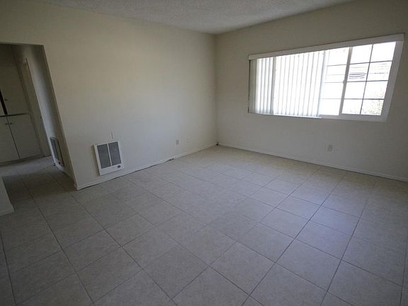 Living room with ceramic tile flooring, new insulated window