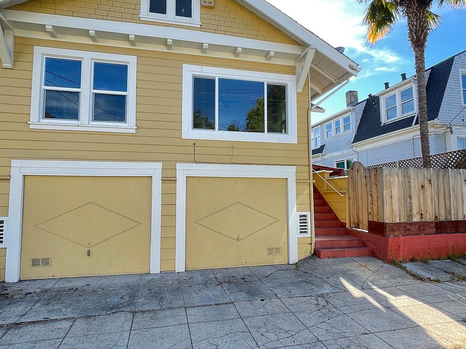 Front apartment windows and right garage.