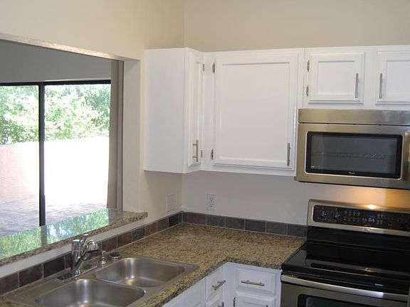 Kitchen with granite counters and stainless appliances