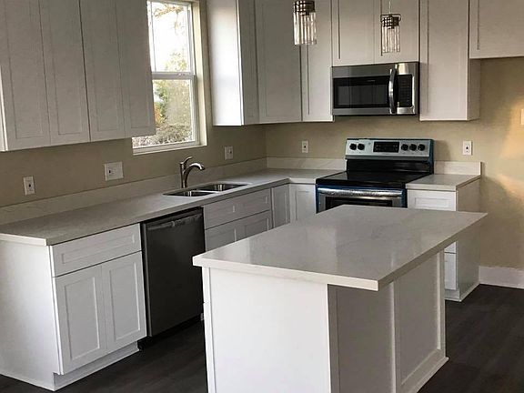 House has stainless steel fridge now.