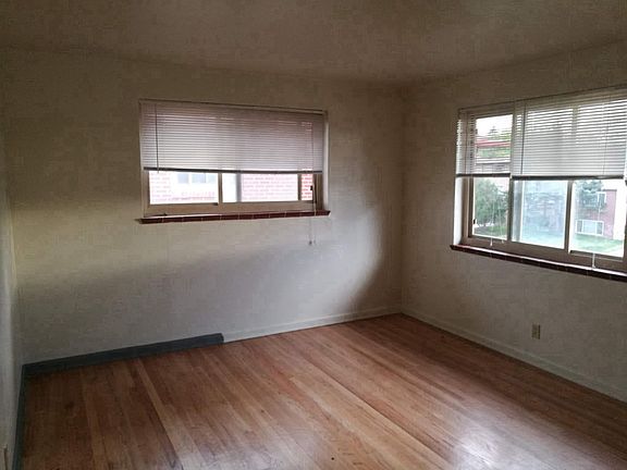 Living room with hardwood floors, new blinds.