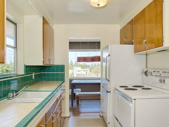 Original tile work & cabinets add to the Mid-Century charm!