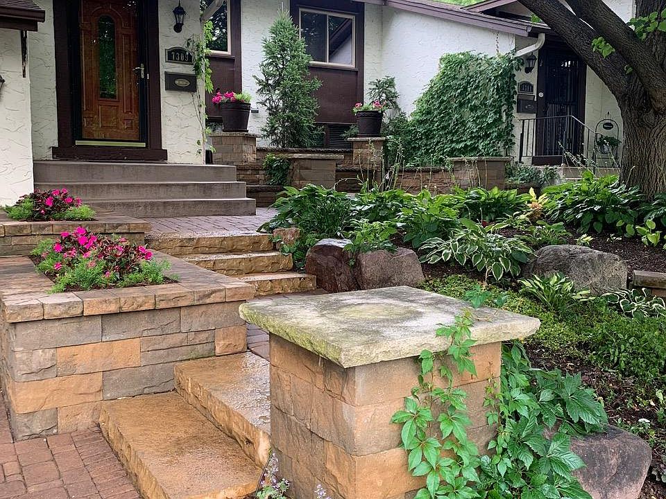 Beautifully landscaped stone entry