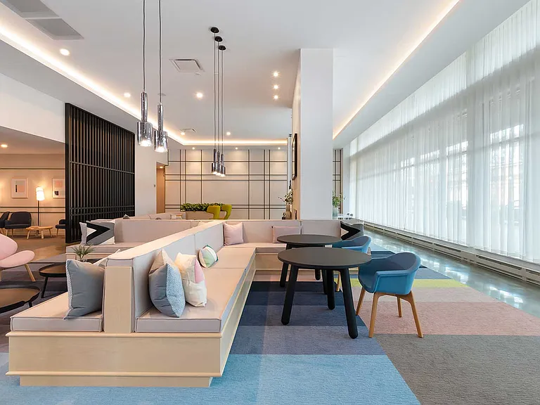 Soft light, modern lines, and warm tones create a lounge that's equal parts style and serenity the perfect place to start or end your day.
