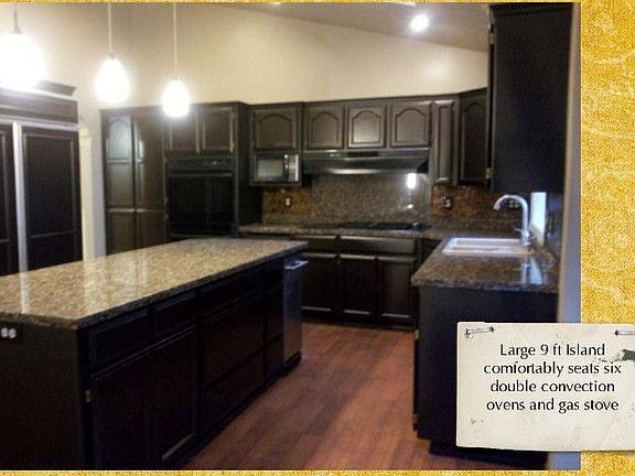 Large Gormet Chef kitchen, with 9 ft granite island, glass tile backsplash