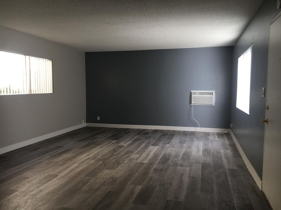 Large Living room and dinning room space all plank flooring with windows and excellent sun light.