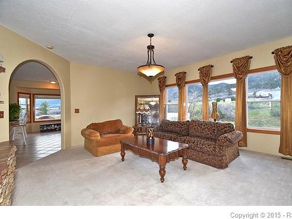 Living room has mountain views to west and a gas fireplace