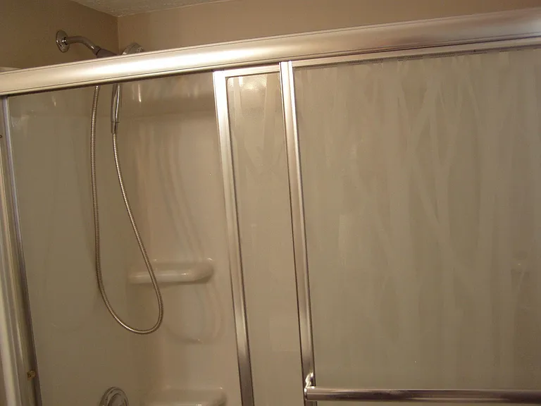 BOTH BATHROOMS HAVE GLASS SHOWER DOORS
NEW FAUCSETS, NEW TOILETS, NEW SHOWERS AND TUB