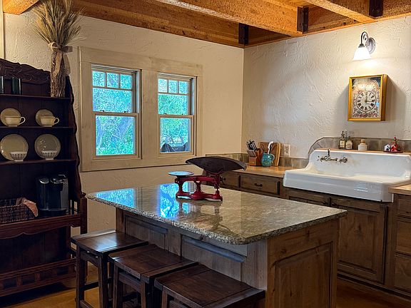 The kitchen is fully-furnished and ready for simple meal prepation. There is one built-in hutch and one hutch/coffee bar. Built-in appliances include a full Miele oven, a Sharp combo microwave, and Unique retro refrigerator.