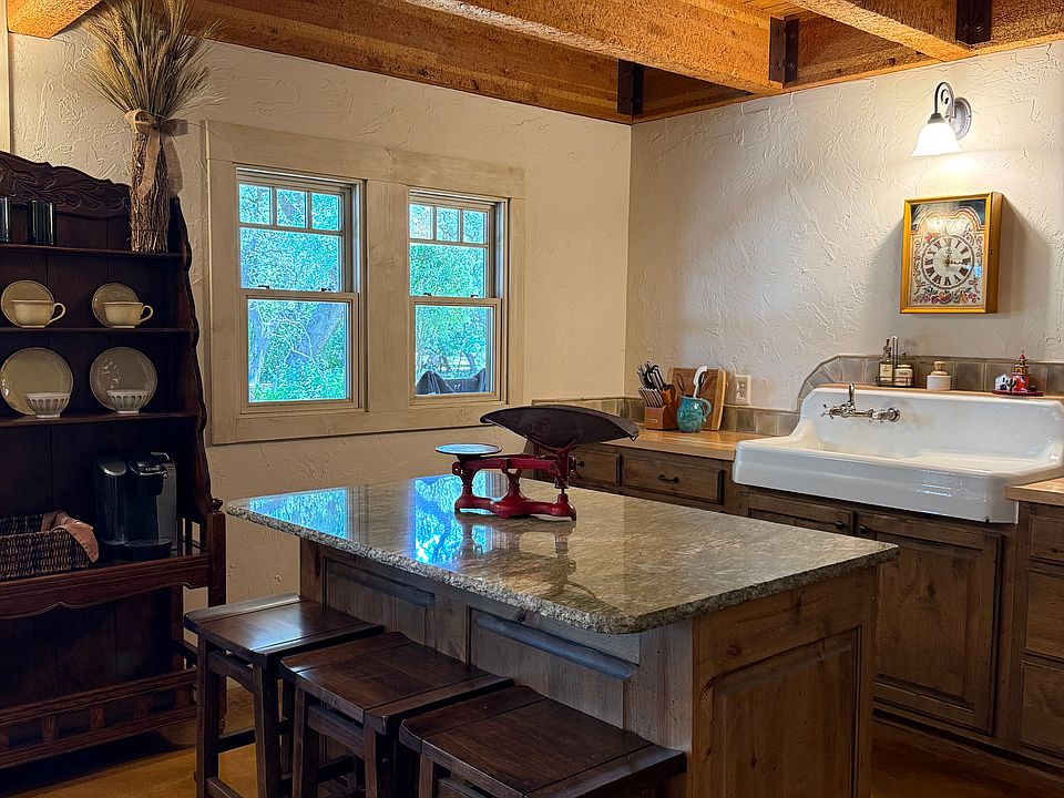 The kitchen is fully-furnished and ready for simple meal prepation. There is one built-in hutch and one hutch/coffee bar. Built-in appliances include a full Miele oven, a Sharp combo microwave, and Unique retro refrigerator.