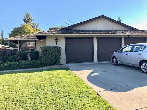 Exterior view - large front yard with 2 car attached garage. Lots of street parking.