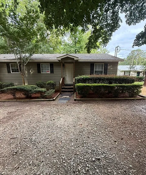 Front of duplex with lake behind