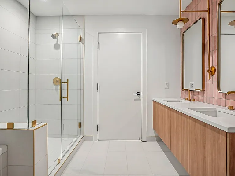 Luxurious bathroom with tub, shower, and dual undermounted sinks