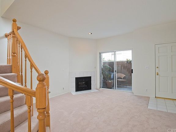 Living Room View To Fireplace And Patio