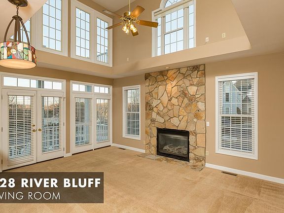 Bright 2-Story Living Room with Stone Fireplace (gas)